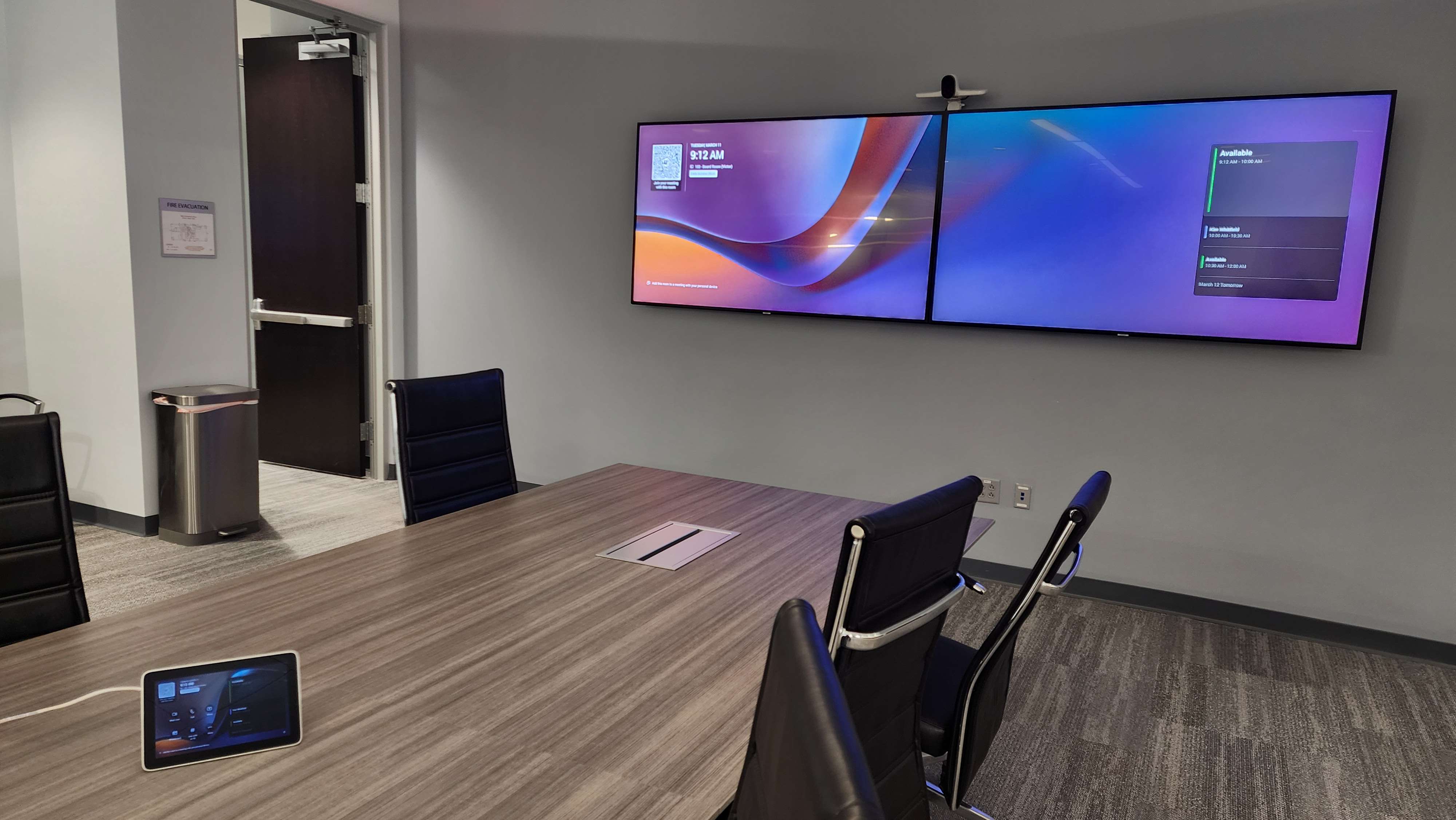 Dual conference room display installation with meeting room controls